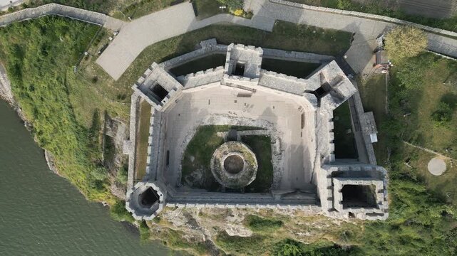 Top-down aerial view of medieval Ram Fortress and Danube river bank in eastern Serbia.