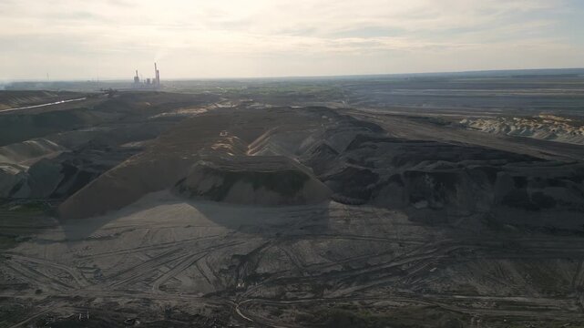 Aerial rising shot revealing an open-pit coal mine in eastern Serbia.