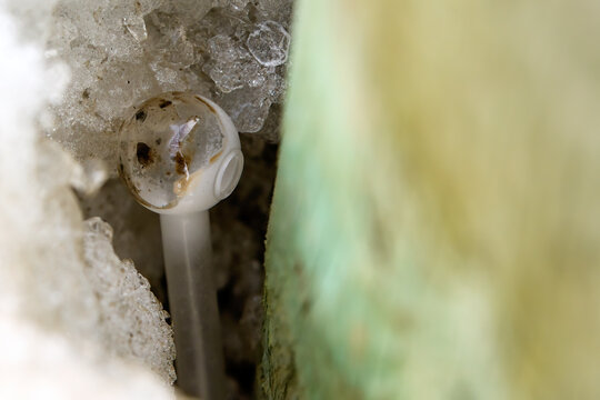 Crack Pipe In A Snowbank Hole
