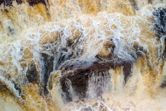 Looking Down At An Overflowing Waterfall