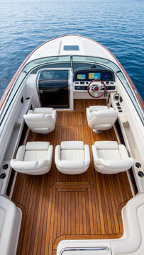 Interior view of a luxury speedboat cockpit featuring white leather seats and a polished wooden teak deck. High tech dashboard with navigation screens and elegant steering wheel.