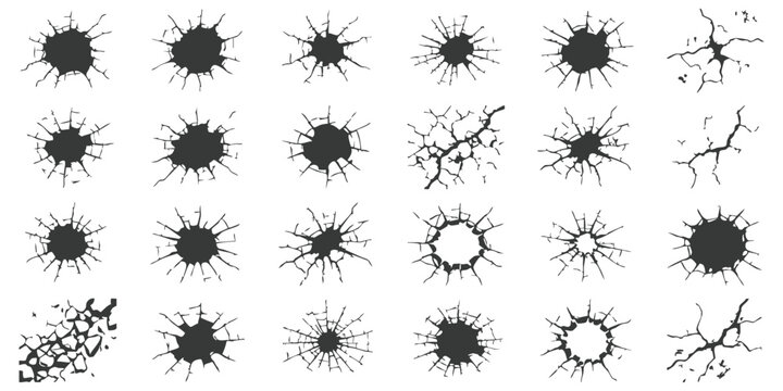 Set of various broken glass cracks and bullet hole impact marks on a surface