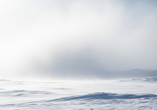Intense whiteout blizzard conditions covering a desolate winter landscape with heavy, driving snow and strong wind, snowstorm, freezing, deep