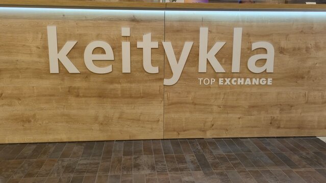Vilnius Lithuania 10.04.2026 Keitykla Top Exchange currency exchange office counter in shopping mall with wooden interior design and financial service branding concept