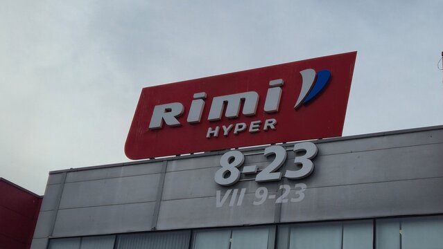 Vilnius Lithuania 10.04.2026 Rimi Hyper supermarket sign on modern shopping center building facade under cloudy sky retail commerce and grocery chain concept