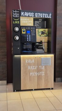 Vilnius Lithuania 10.04.2026 Self service coffee station with automatic vending machine in shopping mall offering fresh espresso cappuccino and takeaway hot drinks concept