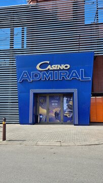 Vilnius Lithuania 18.04.2026 Casino Admiral entrance with illuminated blue facade in urban entertainment district gambling and nightlife business concept