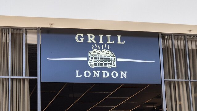 Vilnius Lithuania 18.04.2026 Grill London restaurant sign with illuminated logo in modern shopping mall food court dining and fast food concept