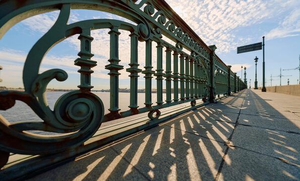 antique wrought iron railings of the Trinity Bridge, Troitsky Bridge on a spring morning