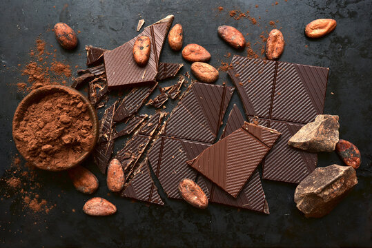 Ingredients for making hot chocolate on a black  background. Top view with copy space.