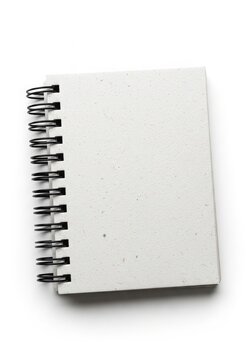 spiral notebook with blank pages and metal coil binding