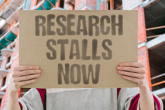 "Research Stalls Now" Scientific progress stalls when government grants are cut without warning. SCIENTIFIC. STALLS. GOVERNMENT. GRANTS. WARNING.