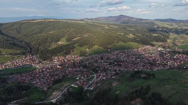 Aerial drone view of Koprivshtitsa historic town surrounded by mountains in Bulgaria
