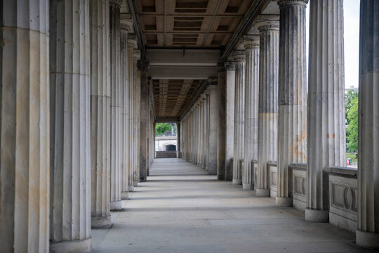 Long classical colonnade with stone pillars at the Museum Island in Berlin. The Colonnade Courtyard Kolonnadenhof near the Old National Gallery.