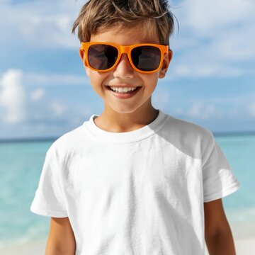 Smiling child in white t shirt mockup and colorful sunglasses by the sea. Beach holiday setting for apparel design presentation