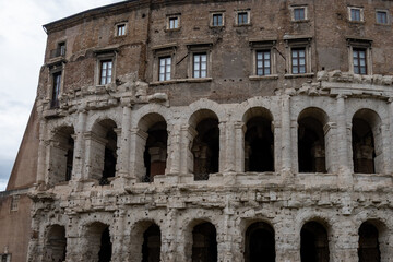 Obraz premium Architectural history in details of ruins, old buildings, walls, amfitheatres, arches in old part of Rome, dated from 300 BC, guided tours in Rome, Italy