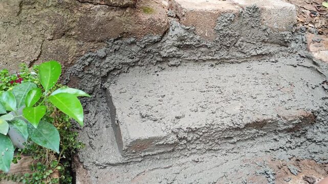 Finishing touches on a handmade cement staircase