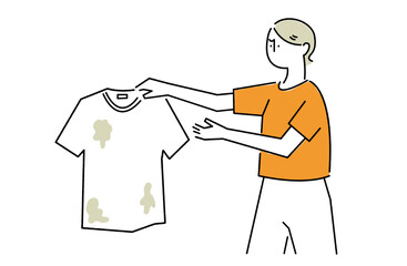 汚れた服を手に取り嫌そうな顔をする女性
