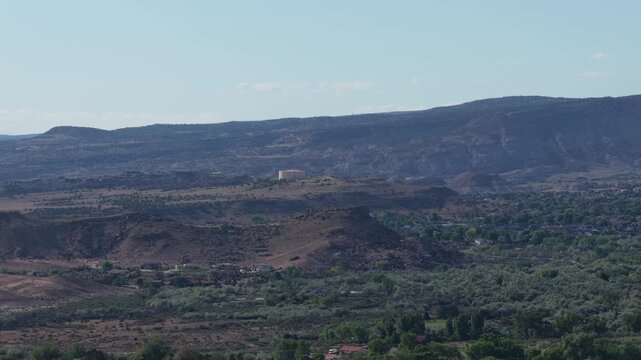 Aerial of Grand Junction Colorado bluffs and high desert mountains in spring