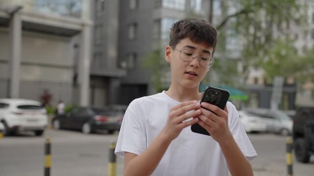 Young user looking at smartphone with confused face while reading message outdoors. Authentic problem, real people, uncertainty and communication concept.