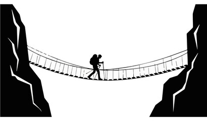 Lone hiker silhouette crossing dangerous rope suspension bridge in mountains © Majedul