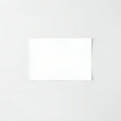 Fototapeta premium Blank white card on a light gray background with copy space