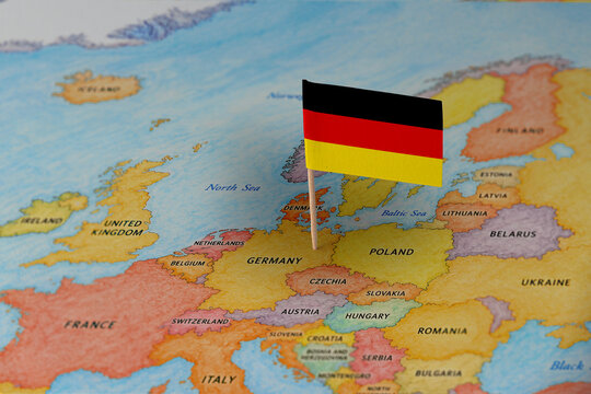German flag pin marking Germany on Europe map, travel destination concept