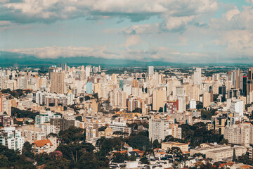 Fototapeta premium Panoramic Cityscape of Curitiba Under Cloudy Sky