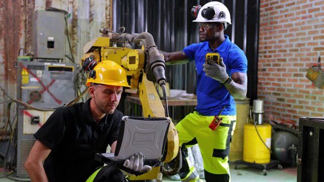 Industrial workers operating machinery in factory action scene professional environment close-up view teamwork concept