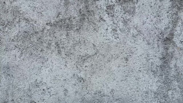 Texture concrete wall of light grey color cement texture background.Grey pastel rough crack cement texture stone concrete,rock plastered stucco wall; painted flat fade background. Side view. close up.