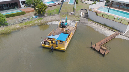 Aerial View of Construction Barge with Excavator in Broadbeach Waters Canal © blueringmedia