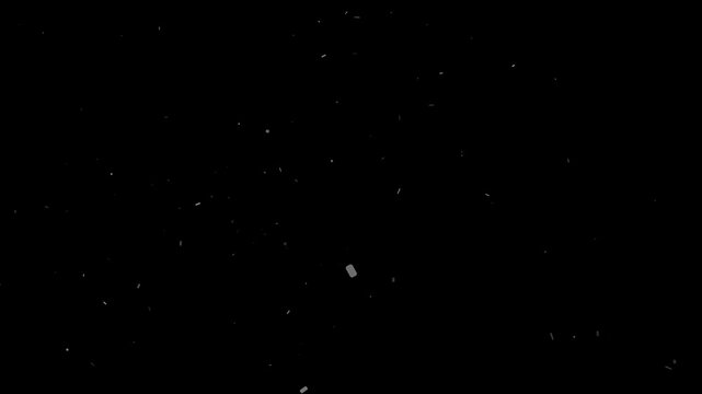 Gentle classic white dust particles slowly float and drift in mesmerizing slow motion on black background