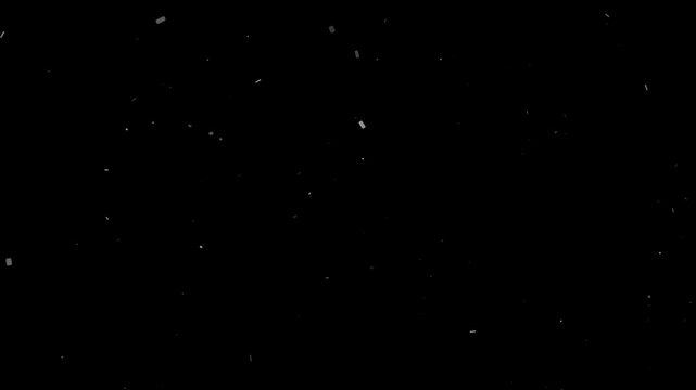 Realistic dust particles floating and shimmering against a dark black background creating an atmospheric video