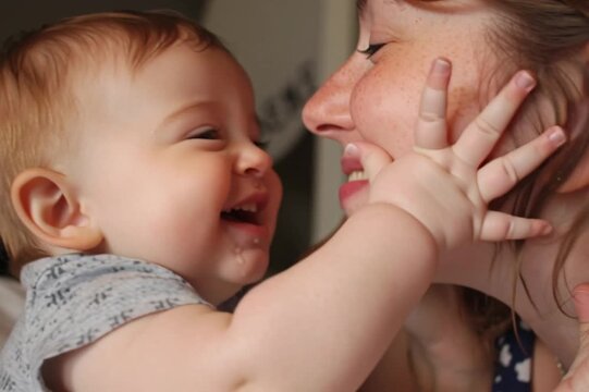 Heartwarming of a mother with her baby laughing and playing together