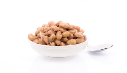 Fototapeta premium Bowl of natto, japanese fermented soybeans, great for asian cuisine menus, food blogs, health articles, and culinary websites.