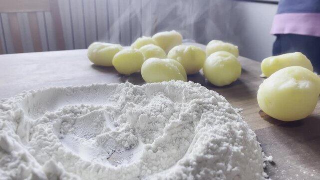 Static Shot of Vapor Rising from Hot Potatoes with Flour for Artisan Pasta Making
