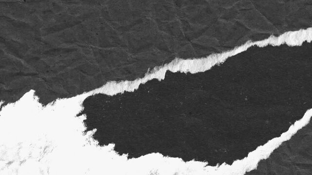 Textured black paper torn revealing white space creating an abstract design for unique backdrops.