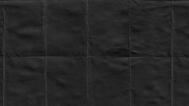 Textured dark paper with creases providing a grungy background and vintage aesthetic