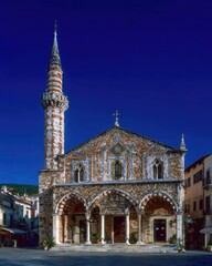 Obraz premium Church with Minaret in a European Town Square