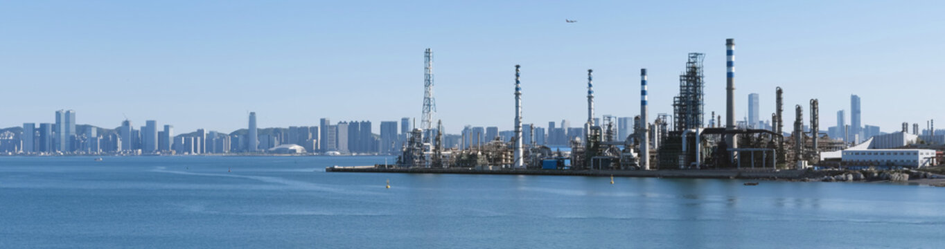 Panoramic View of Dalian Petrochemical Refinery with Modern City Skyline, China

