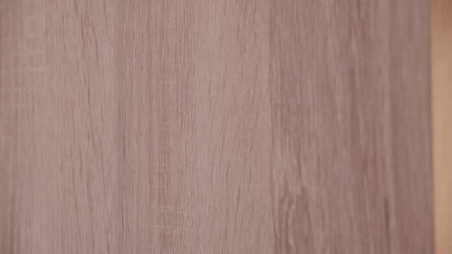 Hand sticking a sticker with thank you Thank you! on a wooden panel. Video footage of acknowledgments.