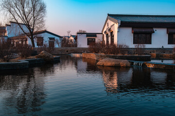 Obraz premium Hailong Lake Scenic Area in Meihekou – Ecological Wetland and Urban Park Landscape with Lakeside Recreation, Commercial Street and Public Leisure Spaces, China – April 2, 2026