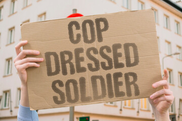 "Cop Dressed Soldier" Police officers routinely wear military-grade tactical gear in civilian settings. POLICE. MILITARY. TACTICAL. GEAR. CIVILIAN. © AndriiKoval