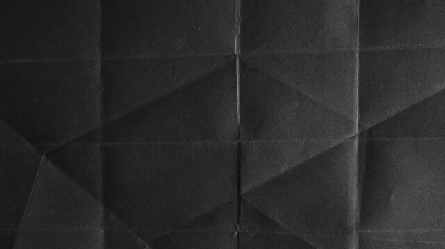 Black Paper Folded with Geometric Shadow Patterns texture