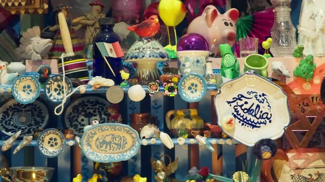 Colorful assortment of handcrafted pottery and decorative items displayed in artisan market