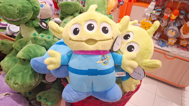 Adorable Pixar Toy Story Alien and Rex plush dolls collection displayed for sale in a department store retail shop for character merchandise collectors  on May 9, 2026 in Bangkok, Thailand
