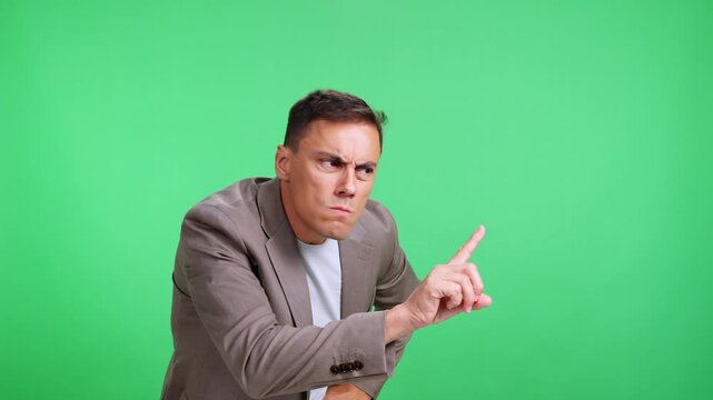 Frustrated and impatient man scolding and arguing on green screen