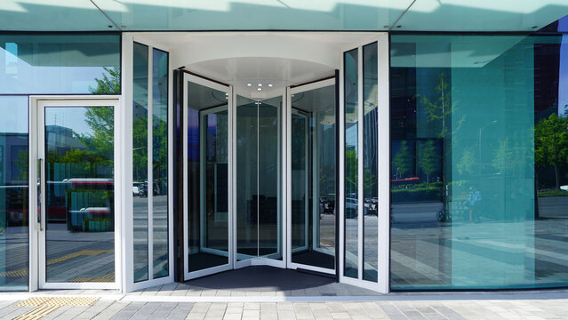 Modern Automatic Revolving Door Entrance in Office Building