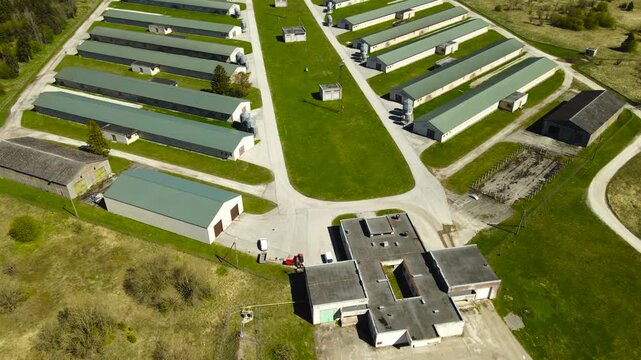 Aerial View Flying over an Industrial Poultry Farm Production Facility