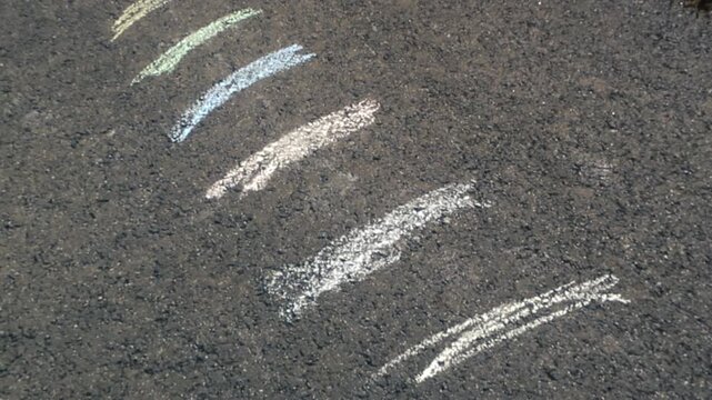 Children Chalk Art Drawings on a Sunny Asphalt Street